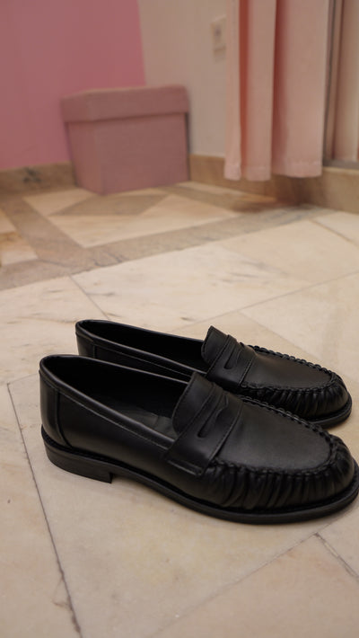 Black leather loafers