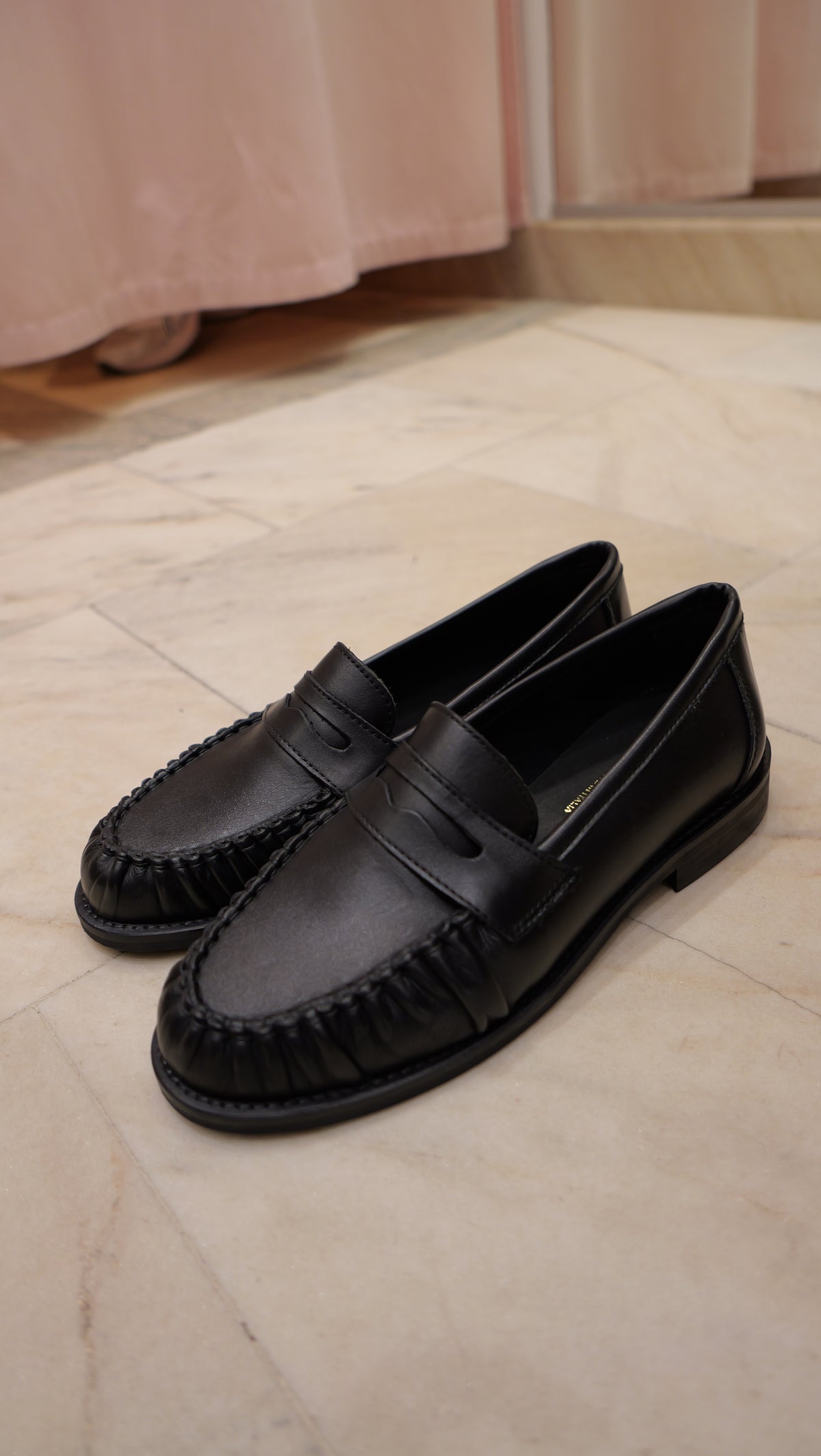 Black leather loafers