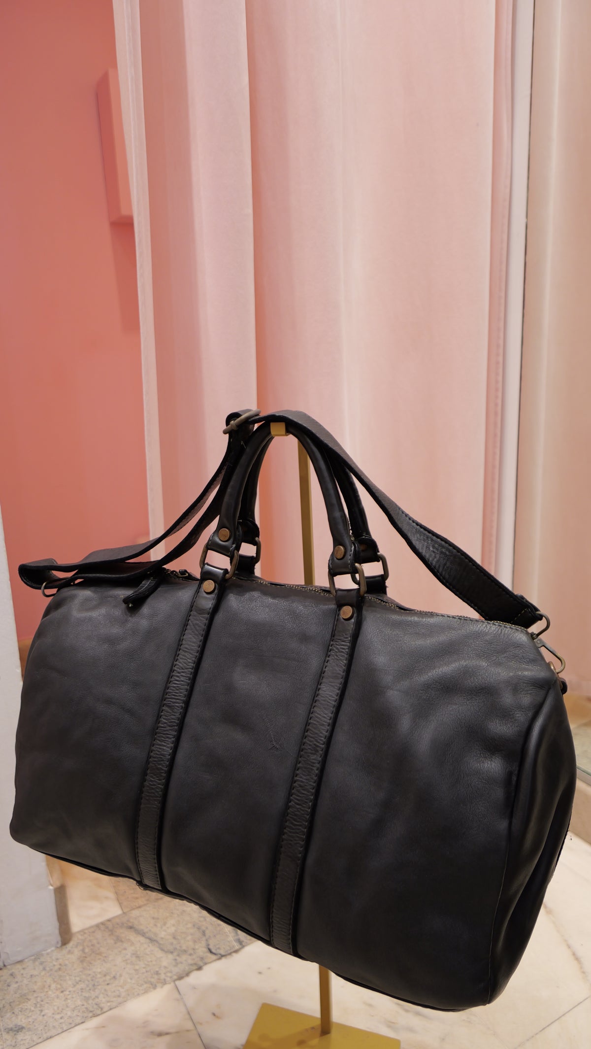 Black vintage leather travel bag