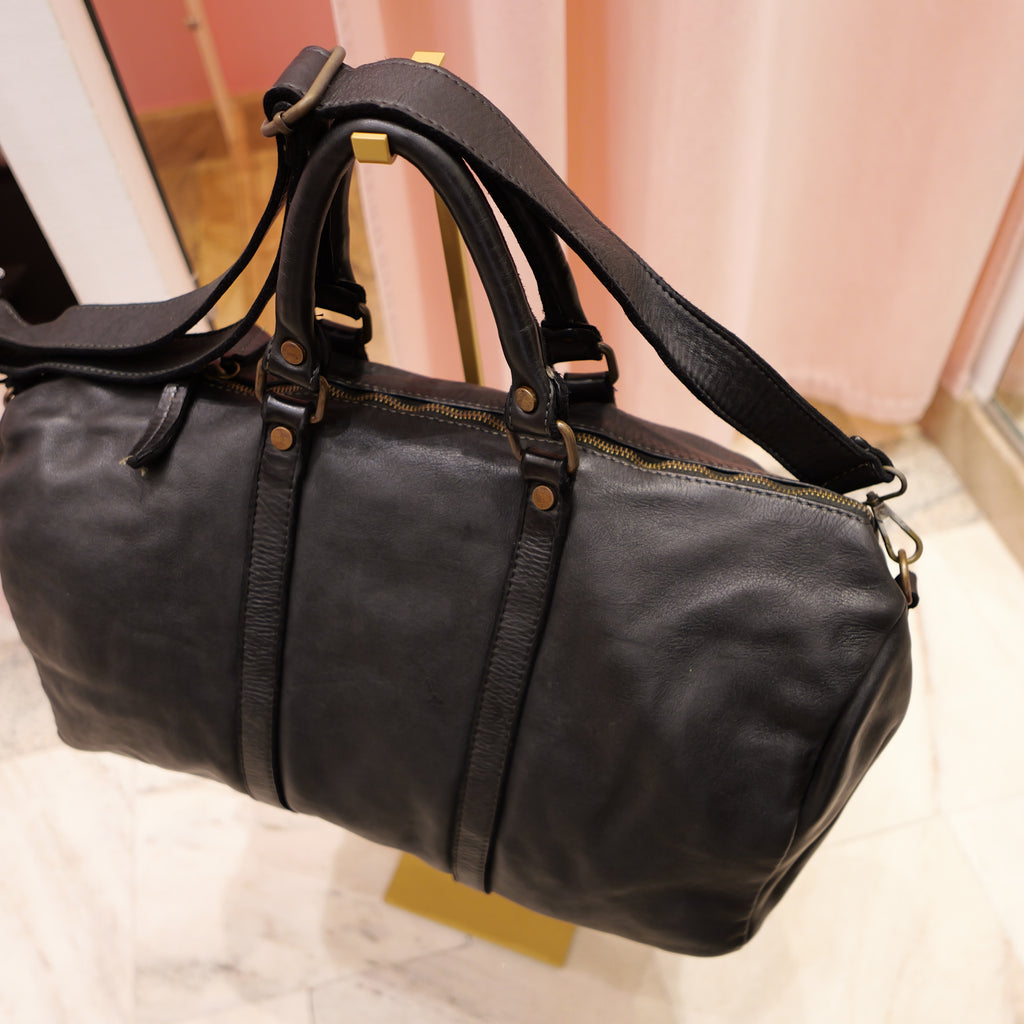 Black vintage leather travel bag