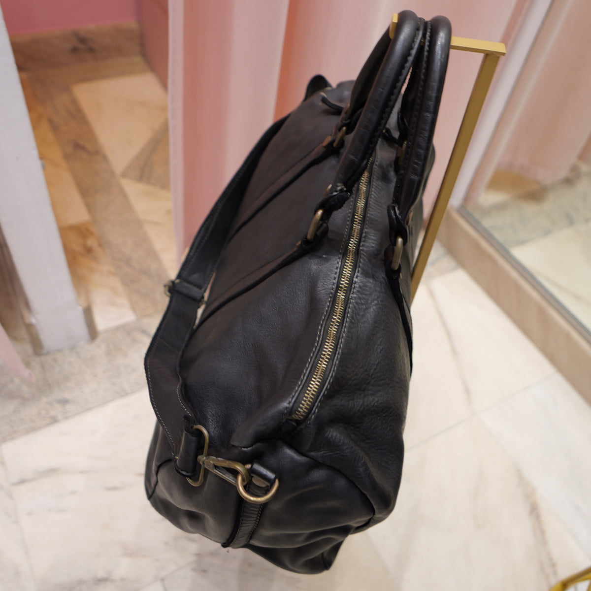Black vintage leather travel bag